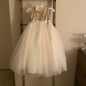 Flower girl dress size 4. Gold sequin with ivory tulle. Heart cut out on back.